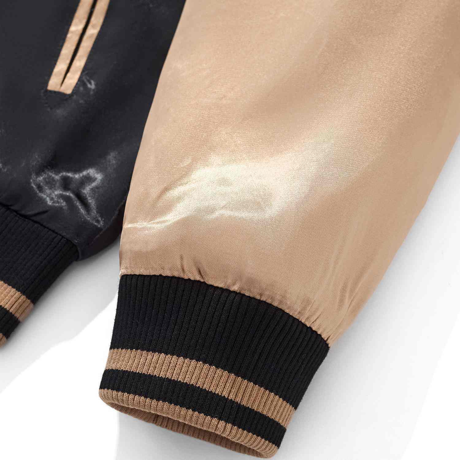 Gold sleeve cuff with striped rib knit and satin sheen.