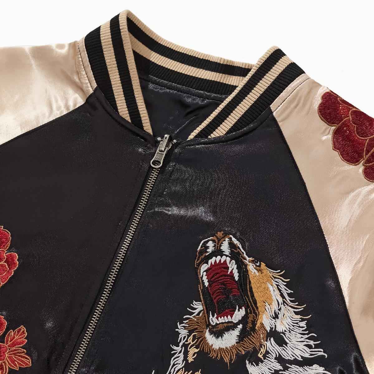 Collar detail — ribbed neckline with roaring lion at right chest.