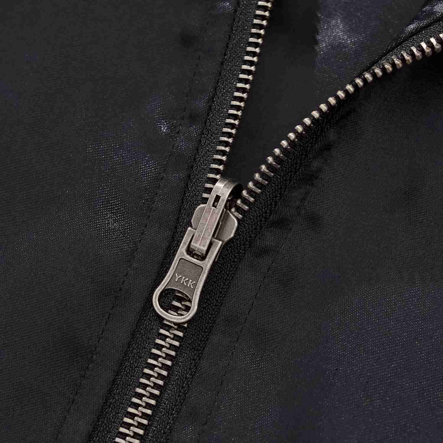 Close-up of the metal YKK zip and clean stitching.