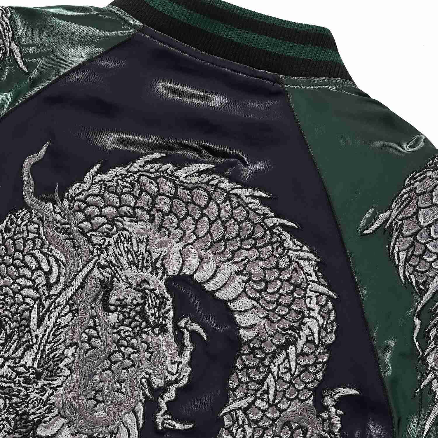 Back shoulder embroidery close-up of coiled dragon scales.