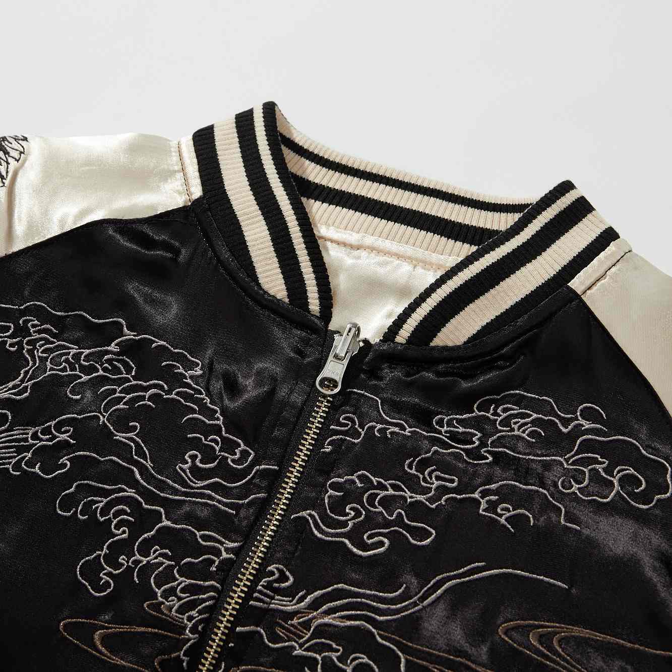 Collar detail — striped rib with cloud stitching on the black side.