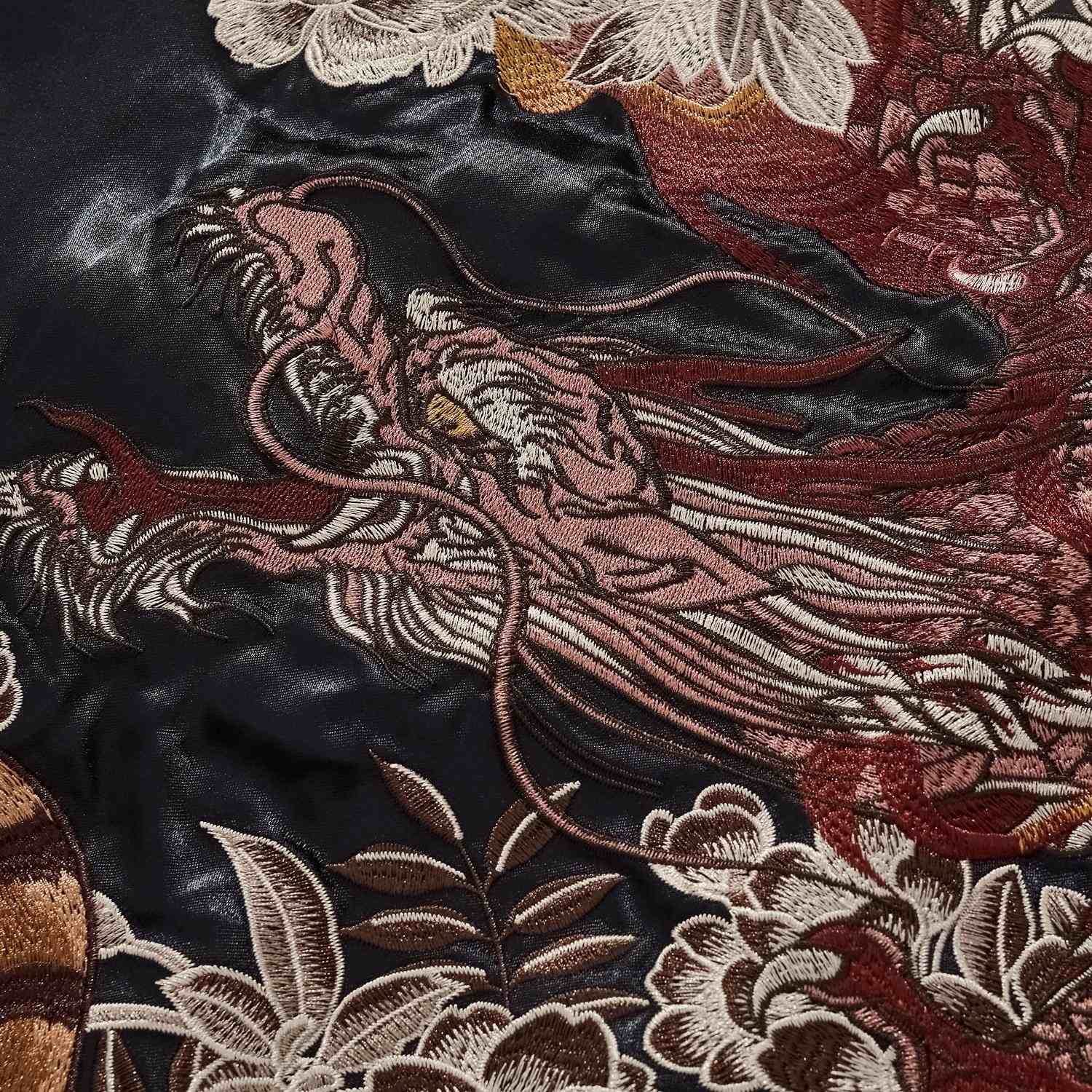 Back detail — flowing dragon mane and scales, fine stitching.