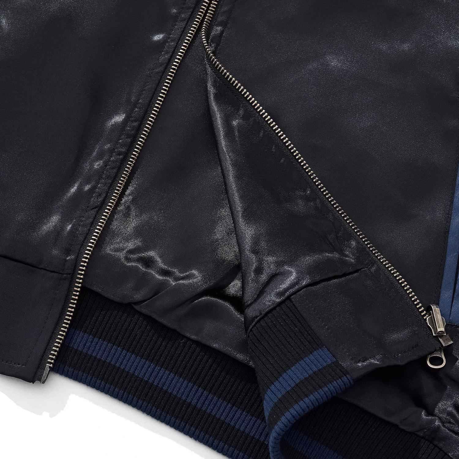 Hem and zipper flap construction close-up.