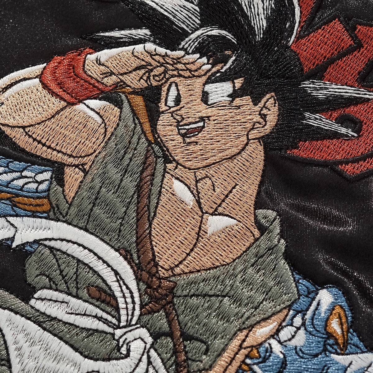 Close-up of embroidered Goku character on Dragon Ball Goku & Shenron sukajan bomber jacket.