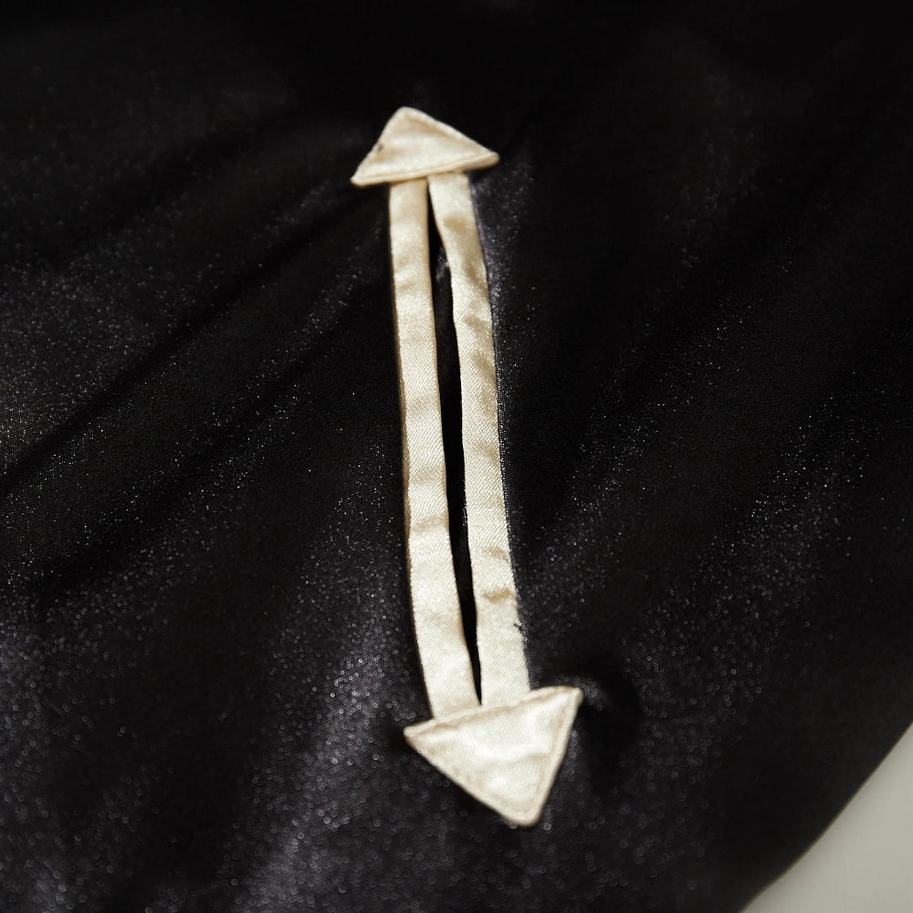 Detail of arrow-shaped welt pocket with beige piping on Dragon Ball Rider anime sukajan jacket.