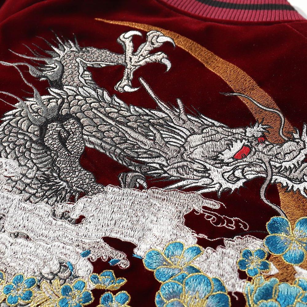Close-up of dragon embroidery showing scales, claws, and swirling clouds