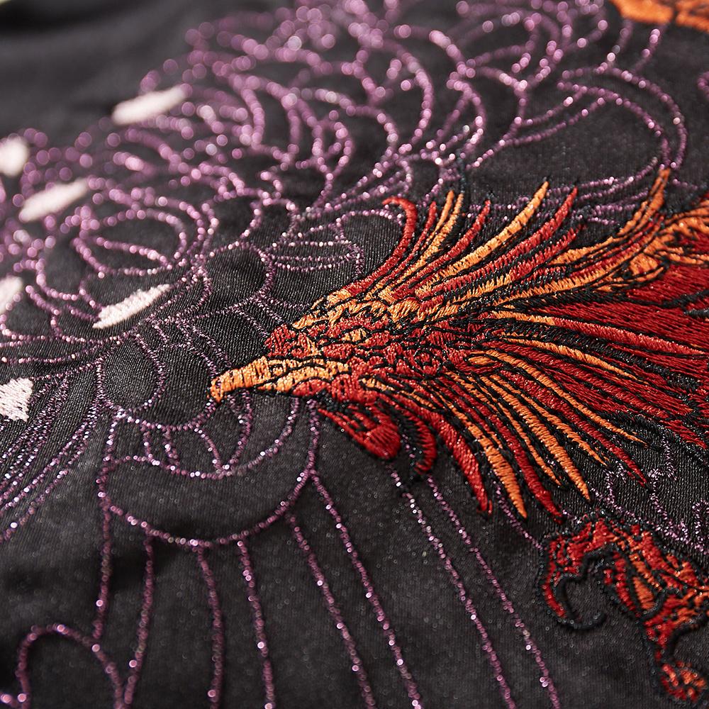Close-up of phoenix head embroidery with chrysanthemum lines on the back of a black sukajan