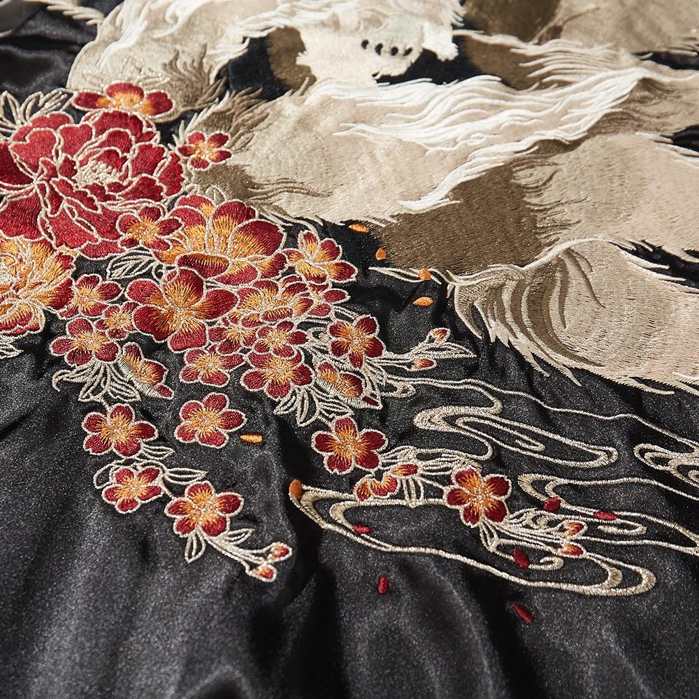 Close-up of blossoms and wave embroidery beneath the nine-tailed fox, back panel