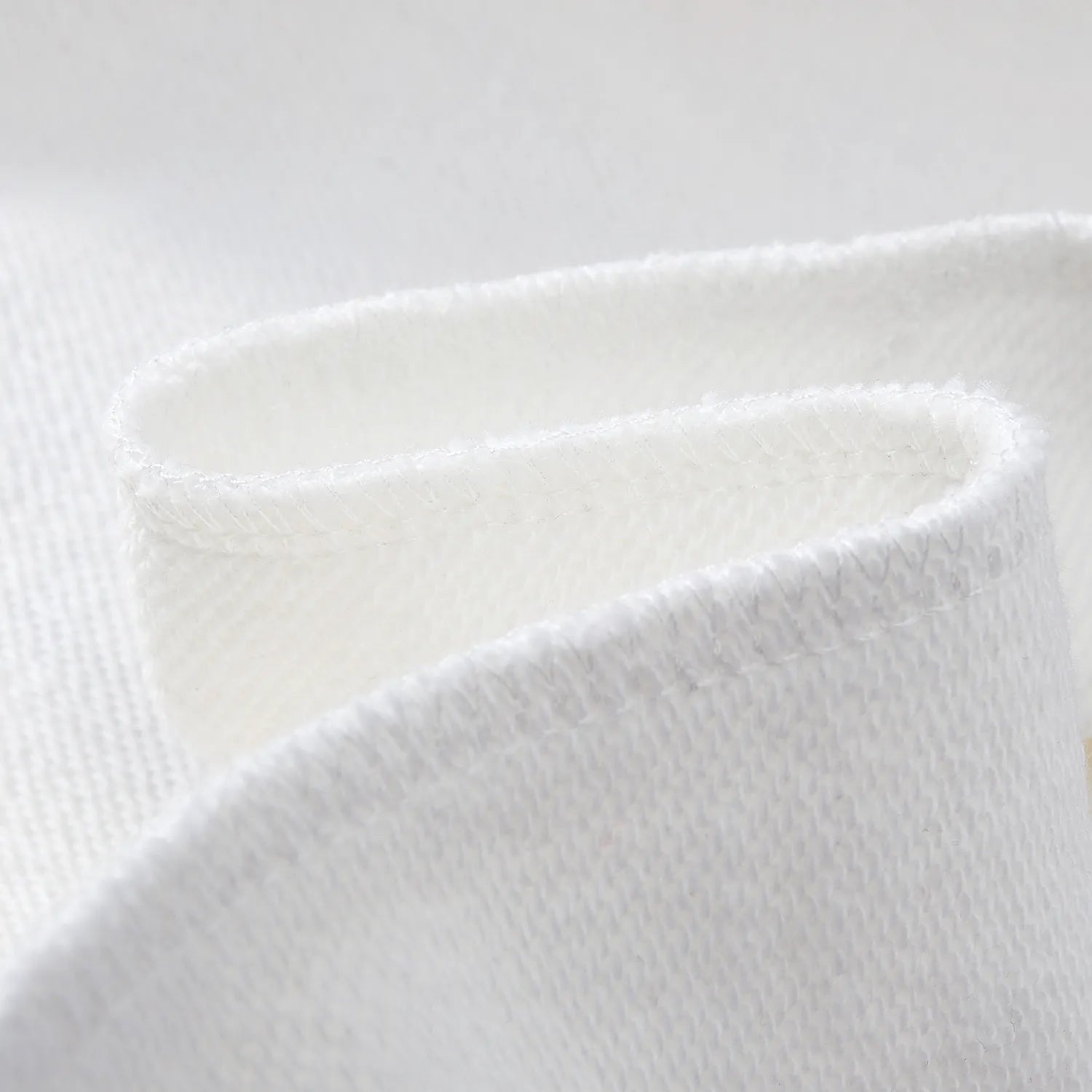 Close up of soft inner fleece fabric on white Nine-Tailed Fox & Lotus sweatshirt.