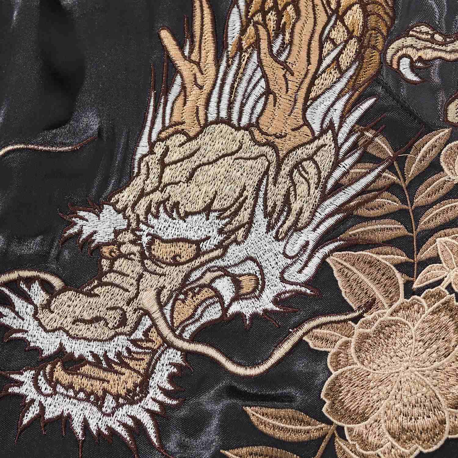 Detail of dragon head embroidery with leaves on the sukajan jacket