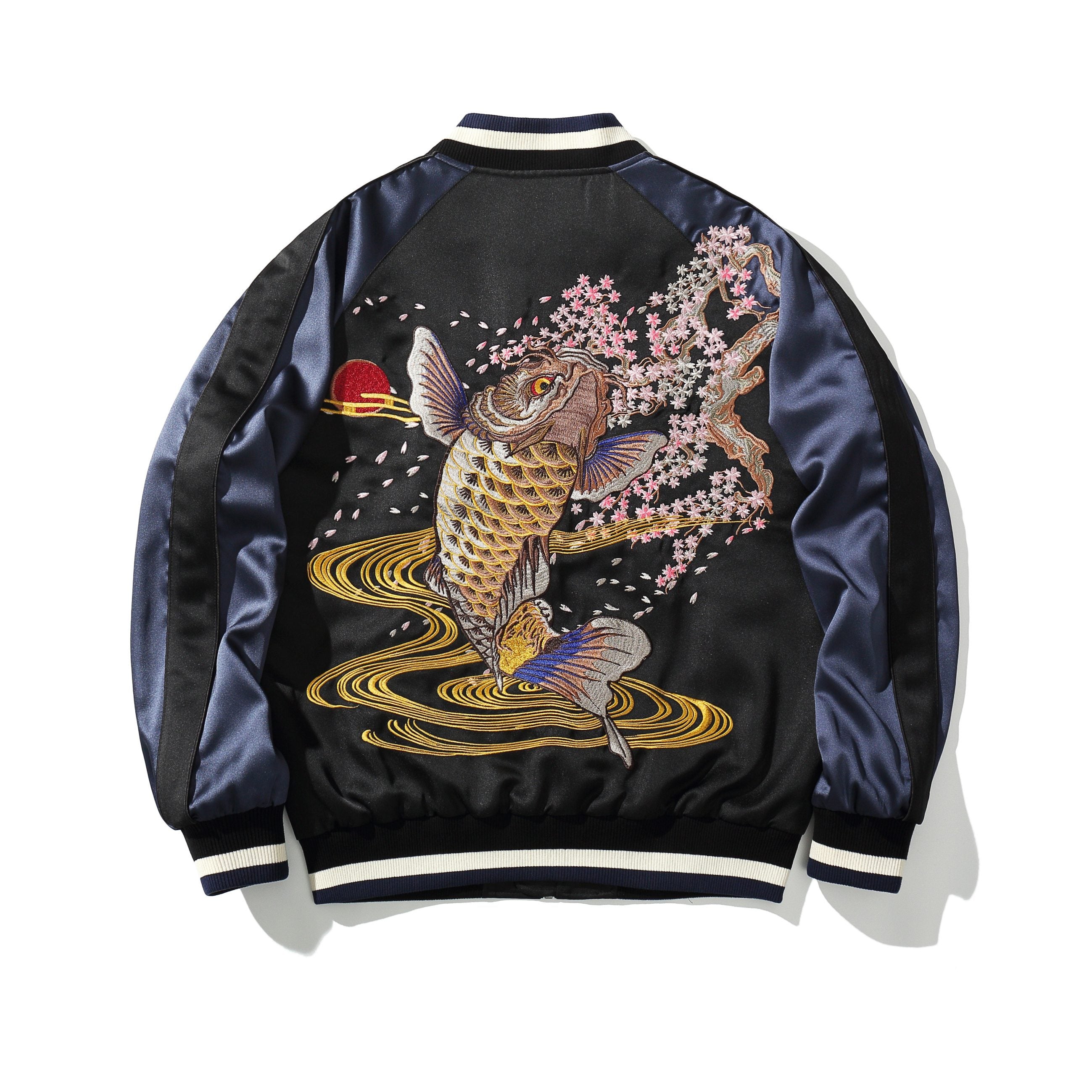Back view in navy sleeves featuring a leaping golden koi amid cherry blossoms and flowing water