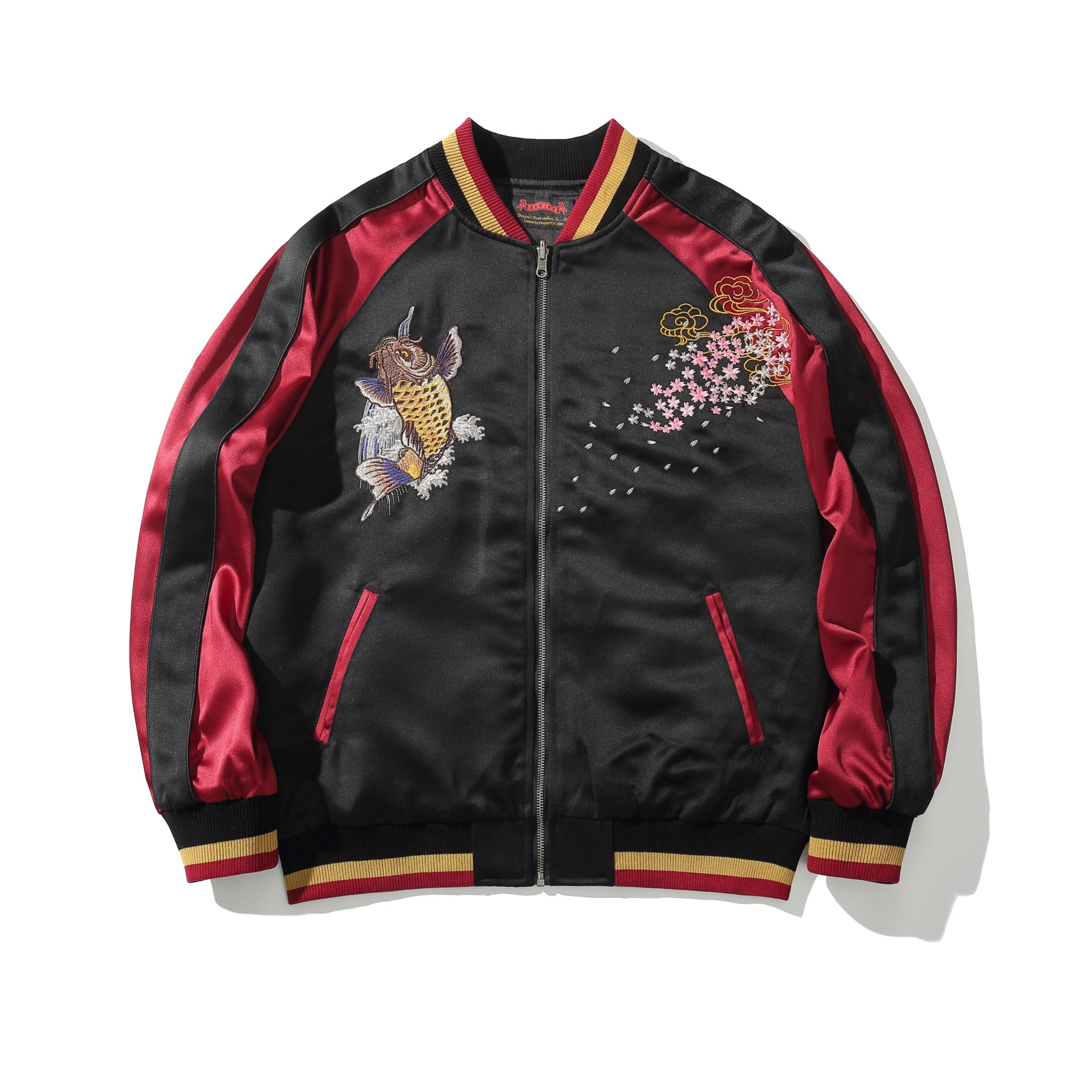 Front view in red sleeves with koi crest at left chest and drifting petals at right chest