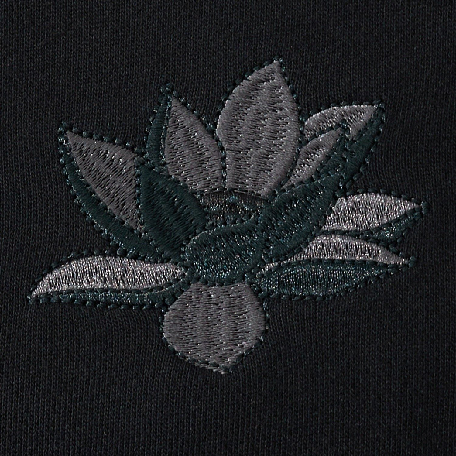 Lotus flower chest embroidery on the black sweatshirt with clean satin stitches