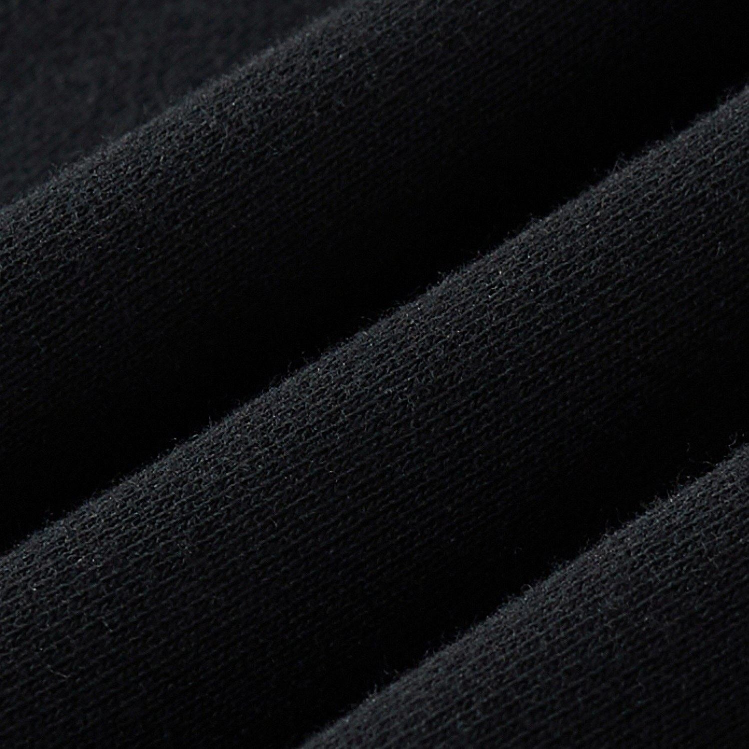 Fabric macro of the black sweatshirt displaying a soft, tight knit