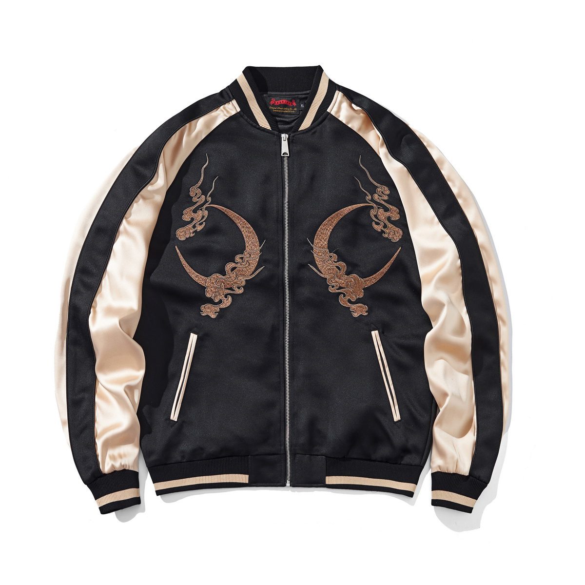 Front view in beige with paired crescent-moon embroidery and contrast ribbed trims