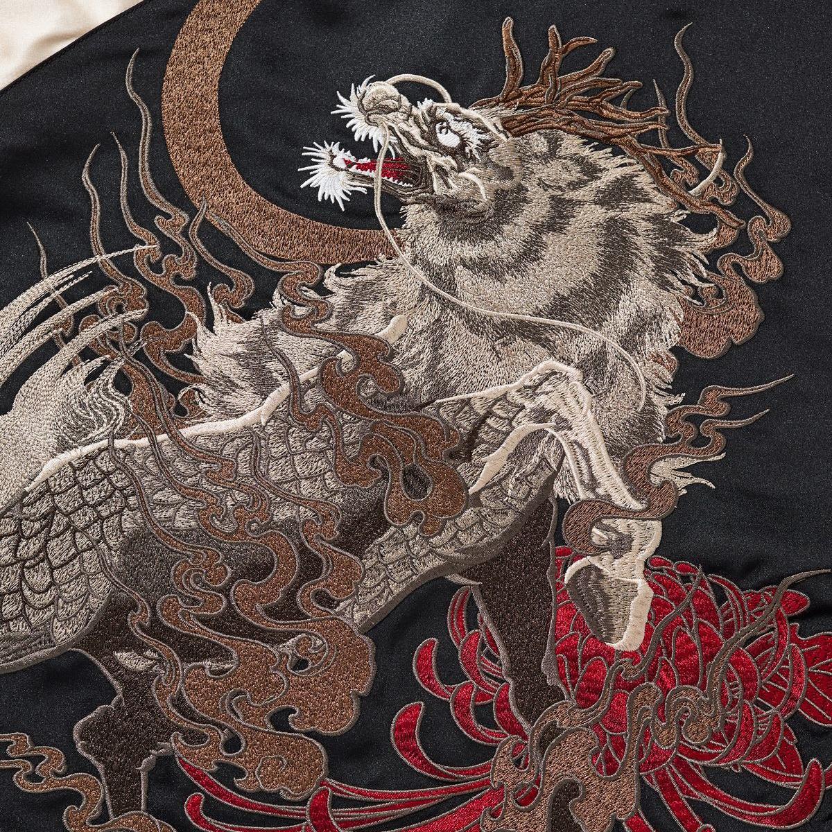 Close-up of the kirin and crescent-moon back embroidery with flowing clouds