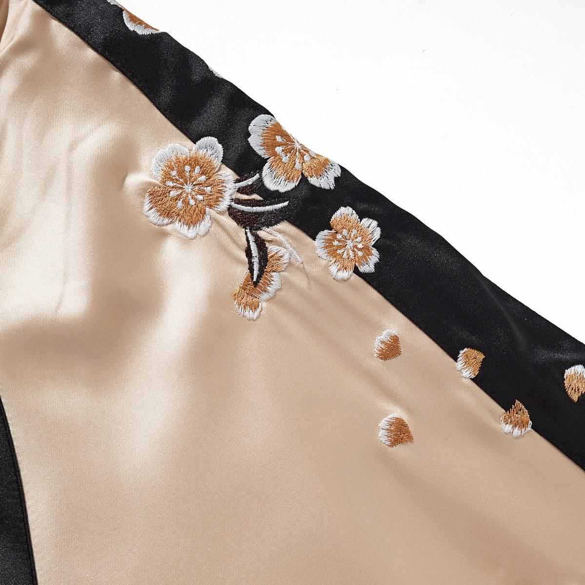 Beige color sukajan jacket sleeve detail with sakura blossom embroidery along the contrast stripe.