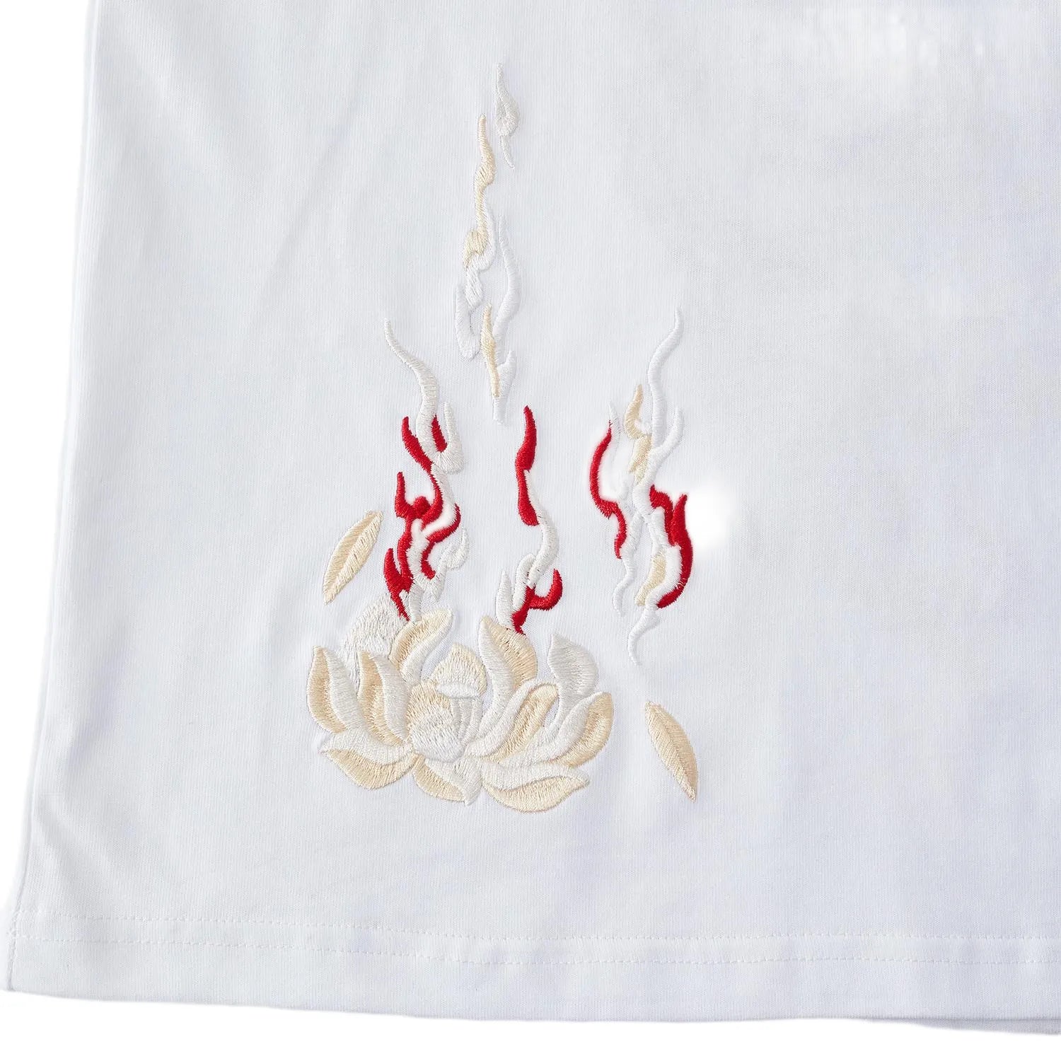 Front view of white pure cotton T-shirt featuring a subtle burning lotus embroidery on the hem.