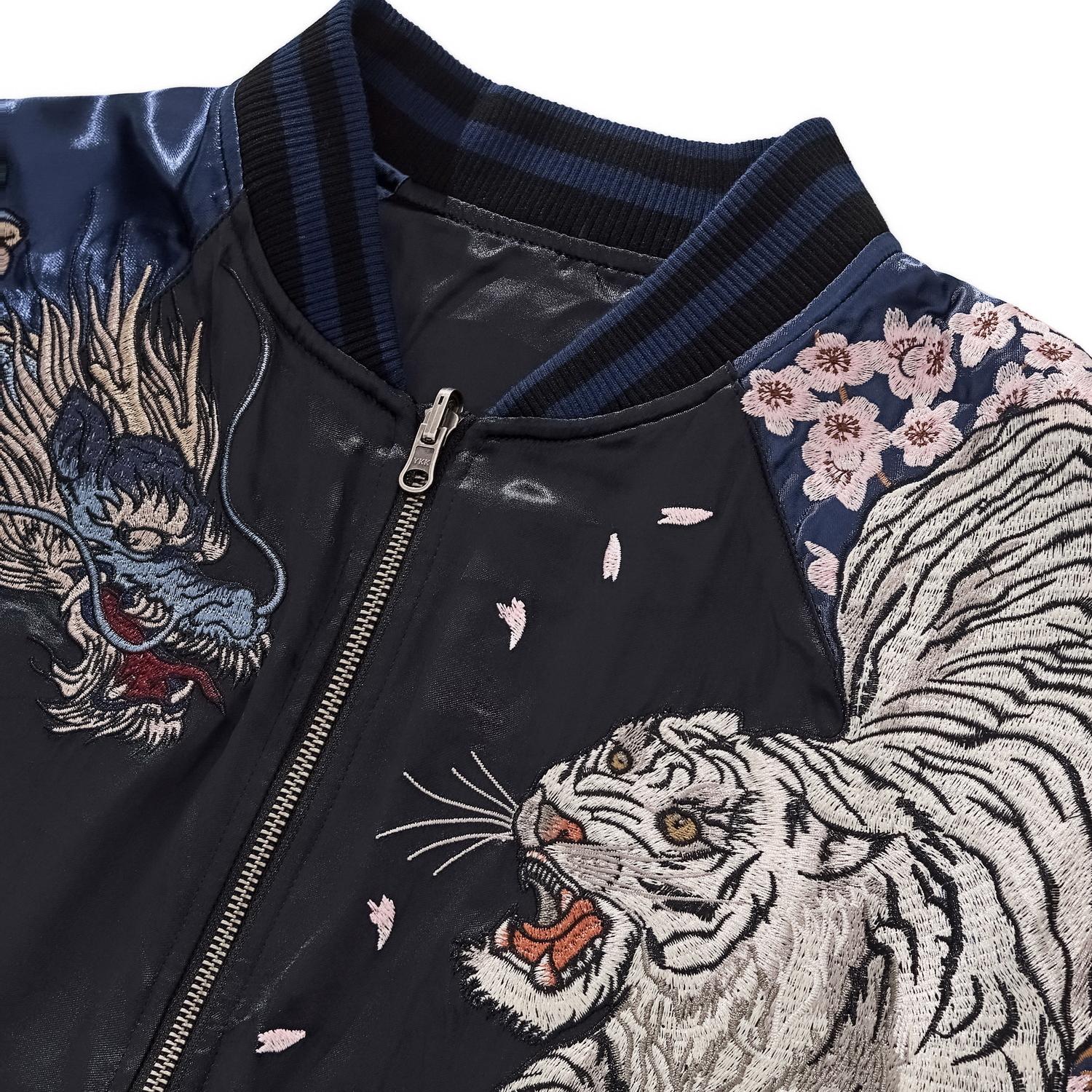 Top-down view of the ribbed collar and chest embroidery of the blue rayon souvenir jacket.