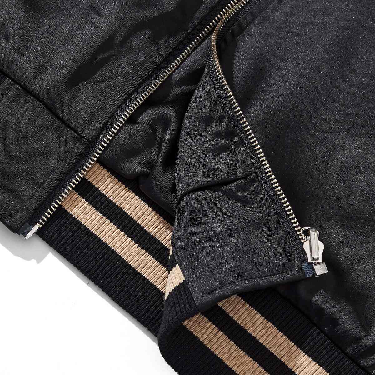 Ribbed hem and front zipper detail on the reversible Lion & Sakura sukajan jacket with clean stitching.