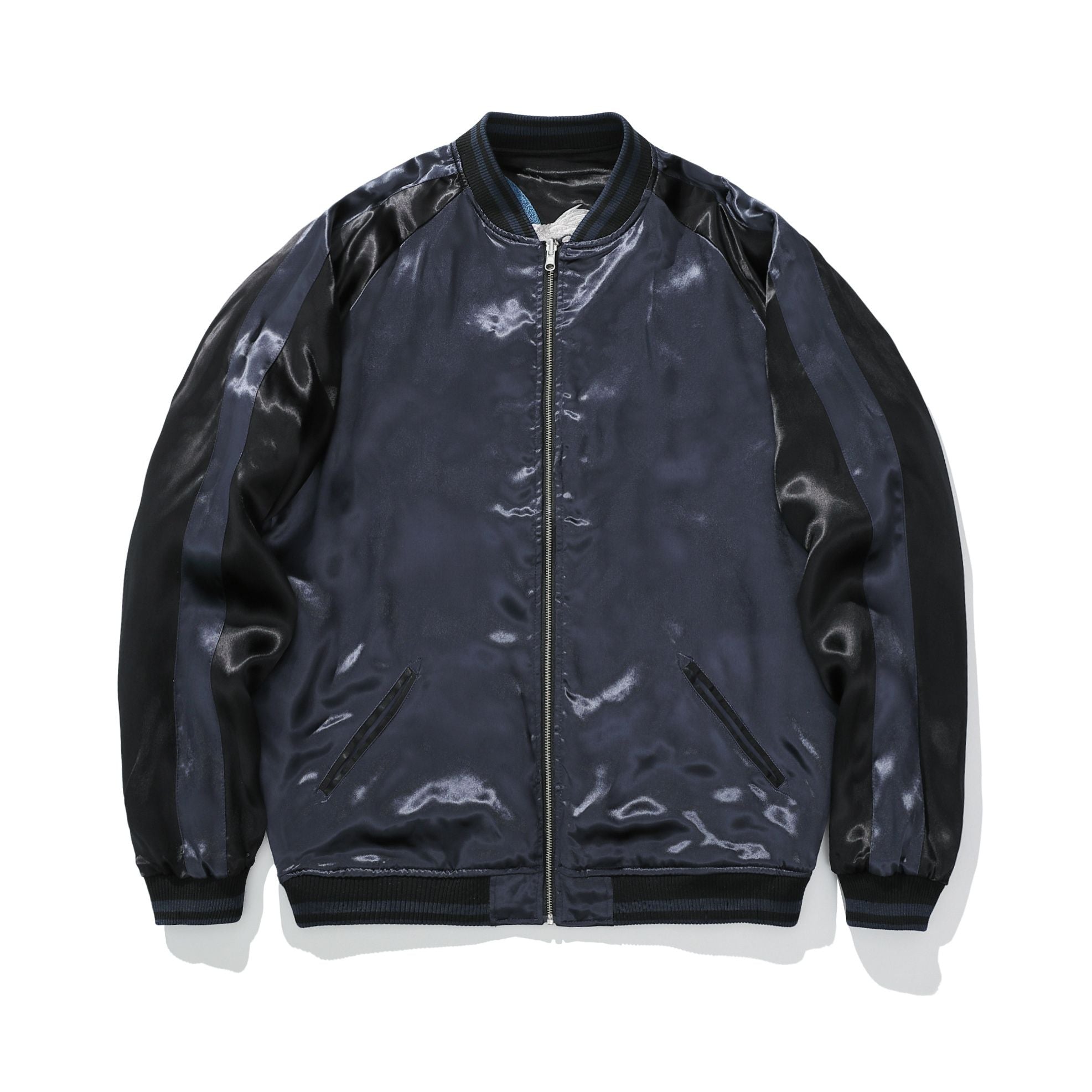 Reverse front—clean satin front with welt pockets and full-length zipper.