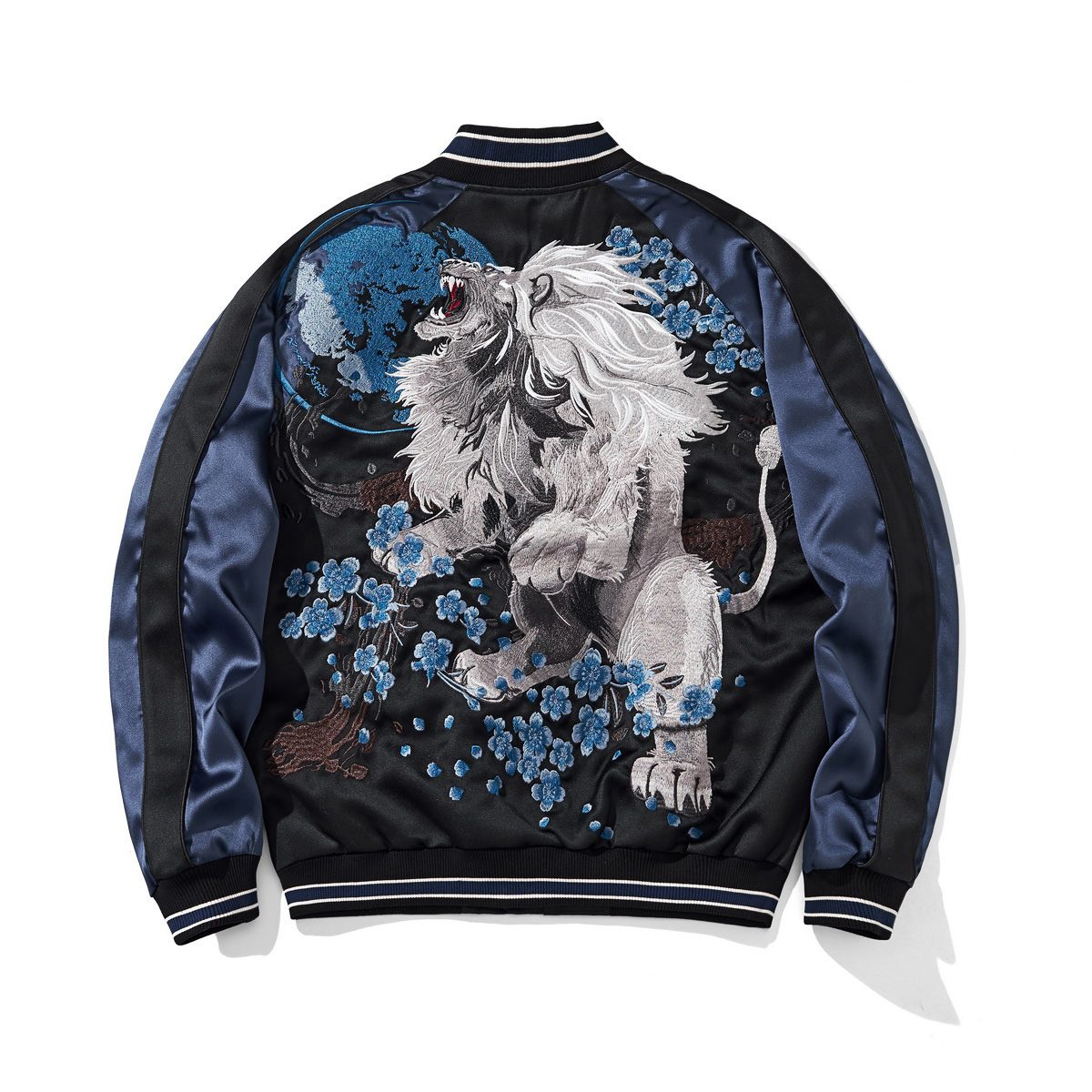 Back view featuring a roaring lion amid blue blossoms under a full moon