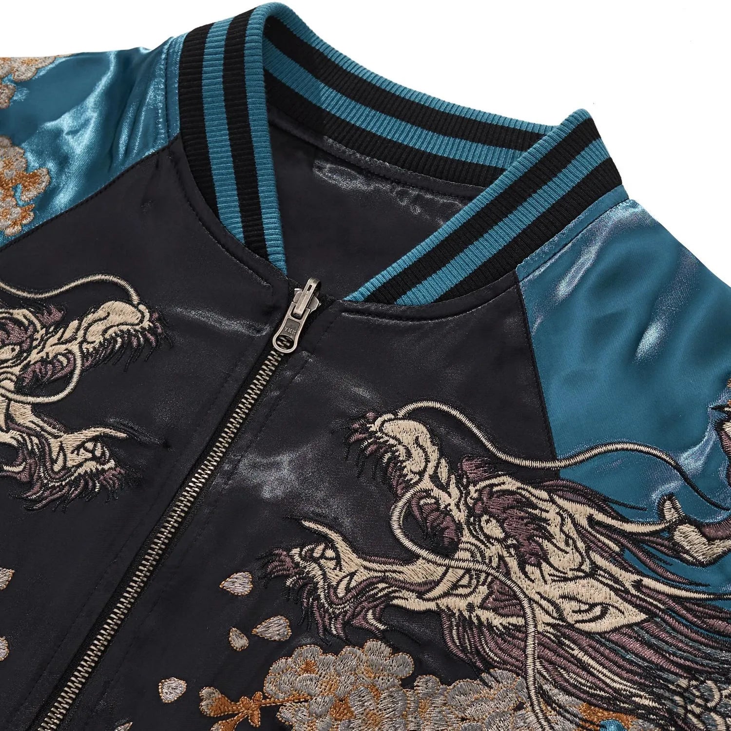 Close-up of the ribbed collar and silver dragon head embroidery on the chest of the blue Sukajan.