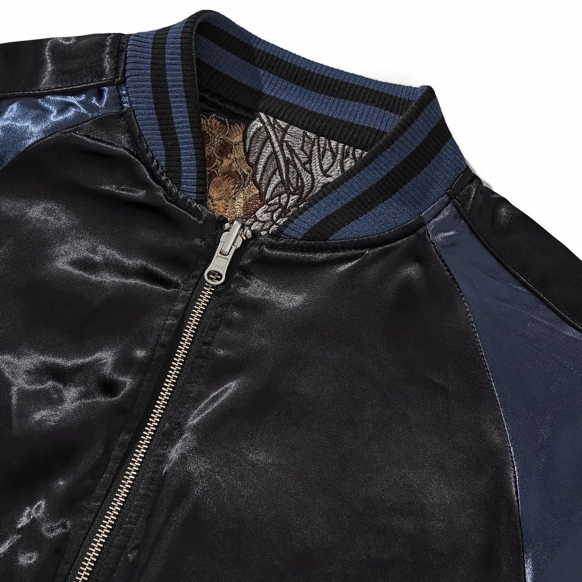 Close-up of striped ribbed collar on plain navy side of Storm Dragons & Peony reversible sukajan.