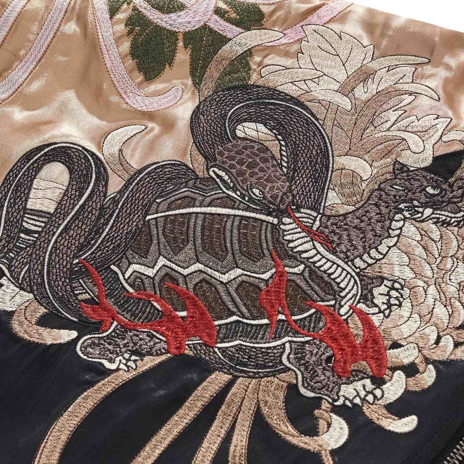 Sleeve detail — Black Tortoise emblem (turtle entwined with serpent).