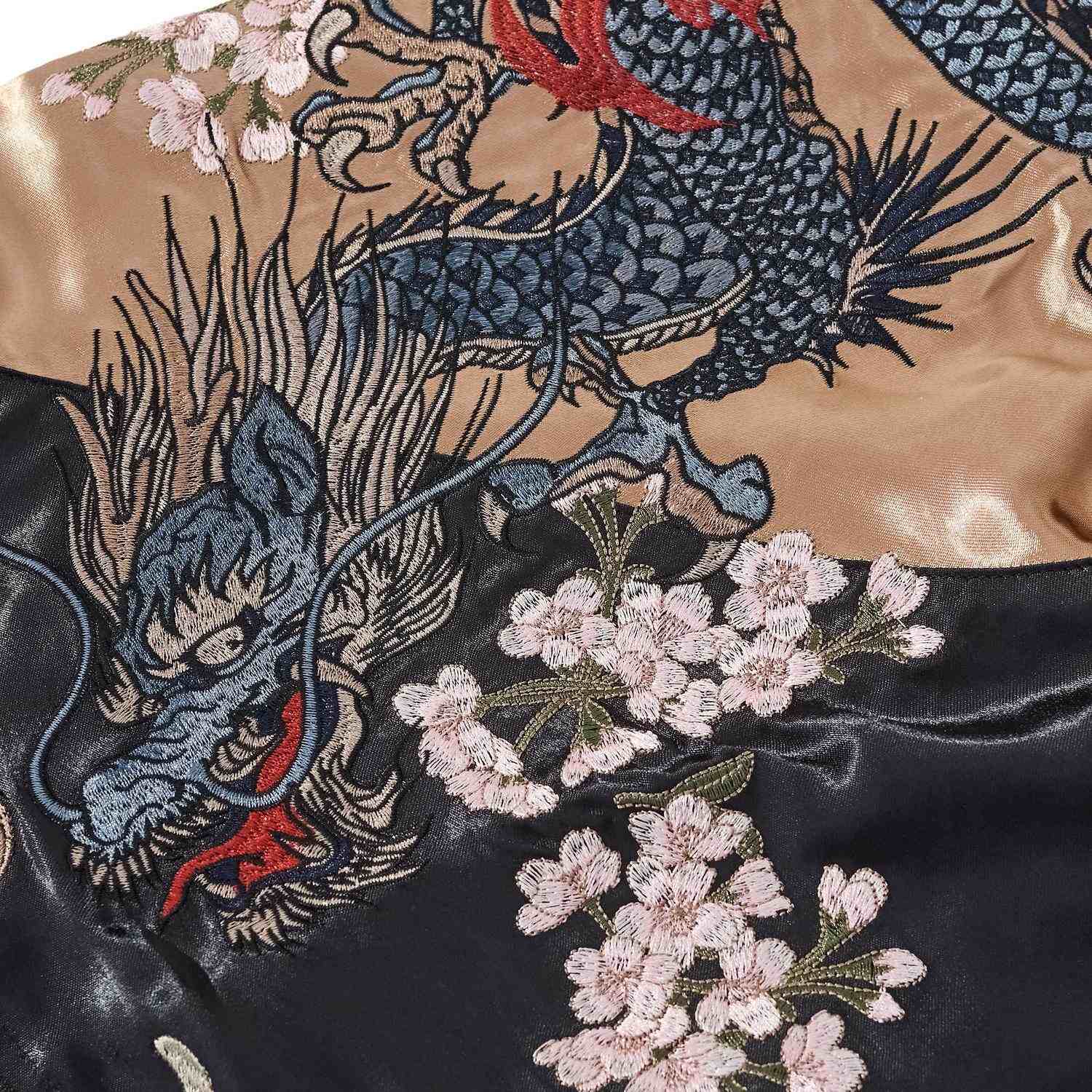 Sleeve detail — scaled dragon intertwined with cherry blossoms.