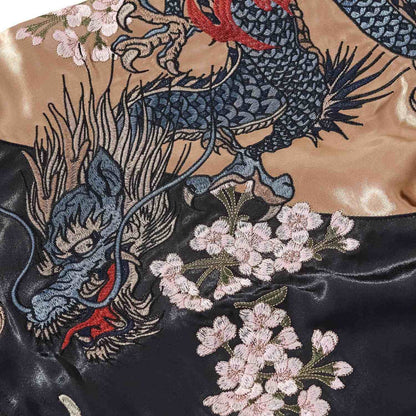 Sleeve detail — scaled dragon intertwined with cherry blossoms.