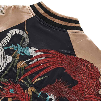 ack-shoulder detail — vermilion bird plumage with layered stitching.