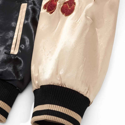 Sleeve detail — Beige sleeve with gold-outlined red peony bouquet.