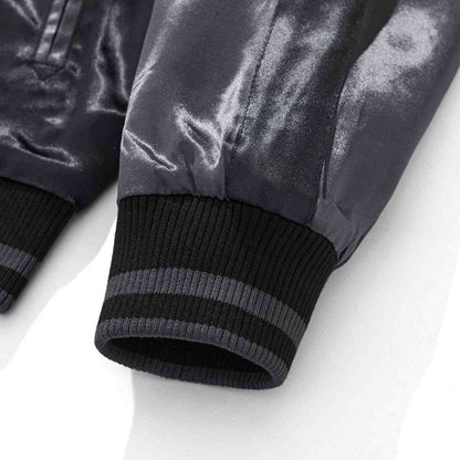 Ribbed cuff detail with contrast stripes.