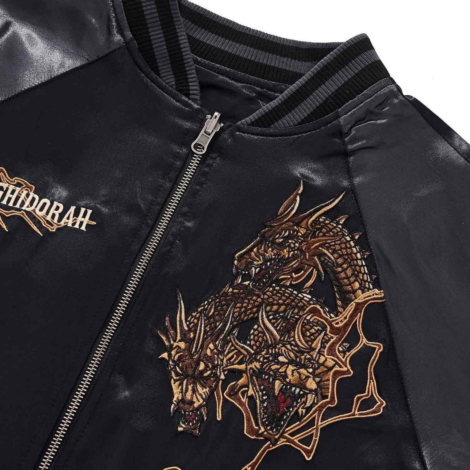 Front collar area close-up with King Ghidorah chest embroidery.