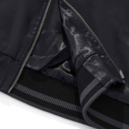Jacket hem and lining close-up with striped rib.