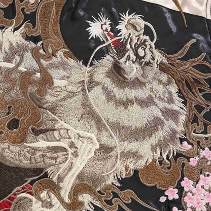 Kirin head with antlers and whiskers; pink sakura and smoke around the moon.