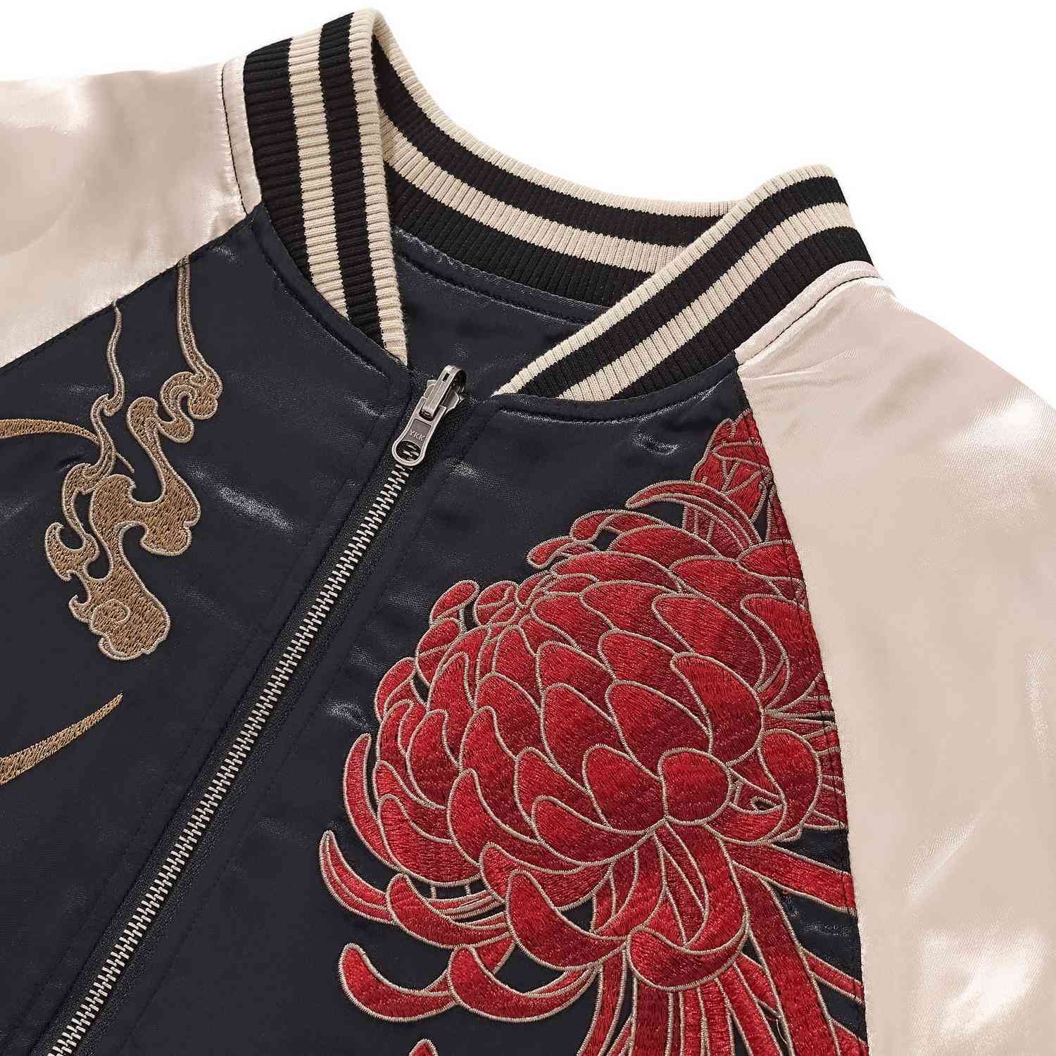 Detail — ribbed collar and zipper; raised embroidery of red chrysanthemum on navy panel.