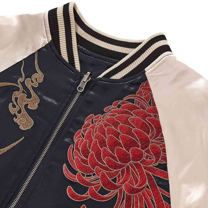 Detail — ribbed collar and zipper; raised embroidery of red chrysanthemum on navy panel.
