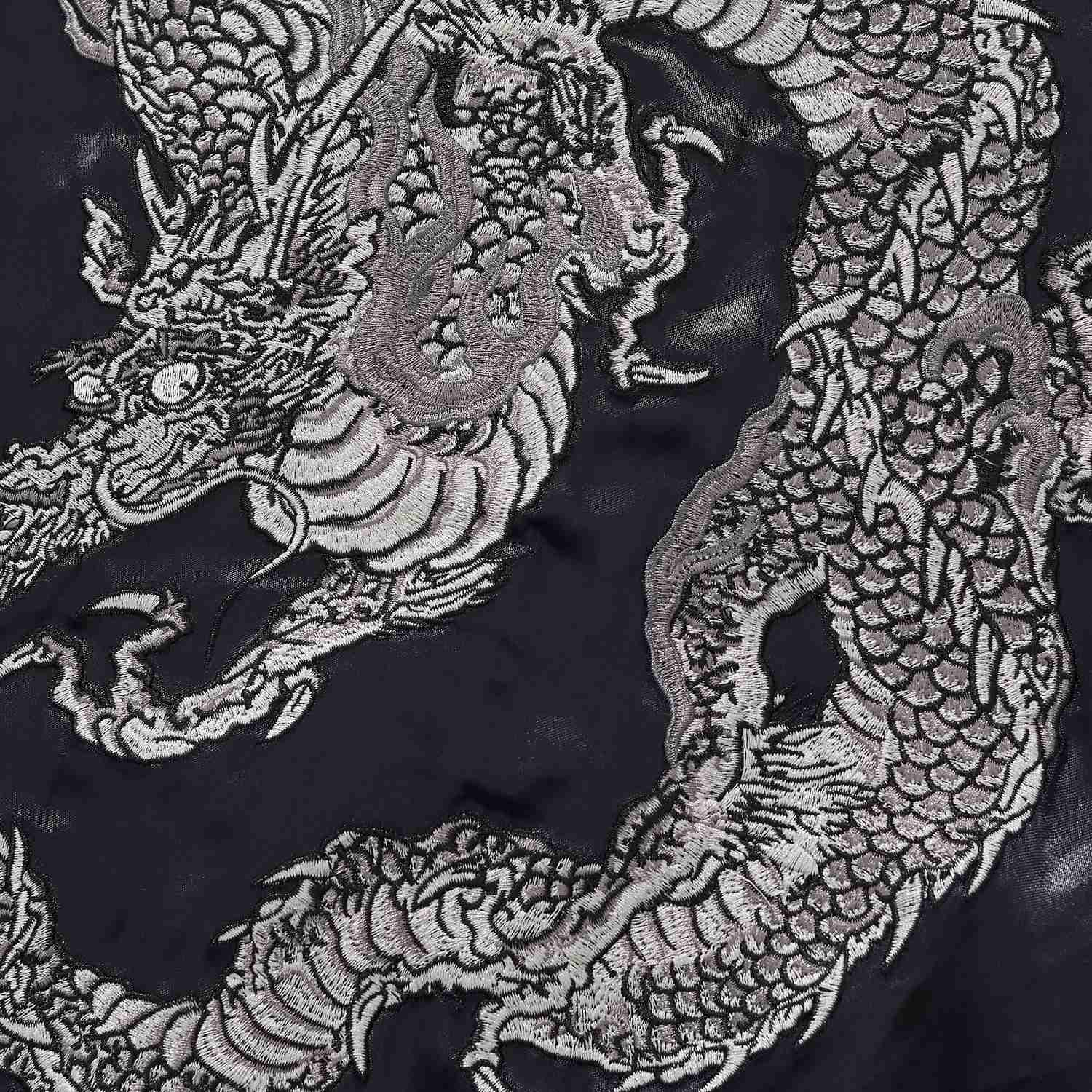 Coiled dragon body detail highlighting layered scales.