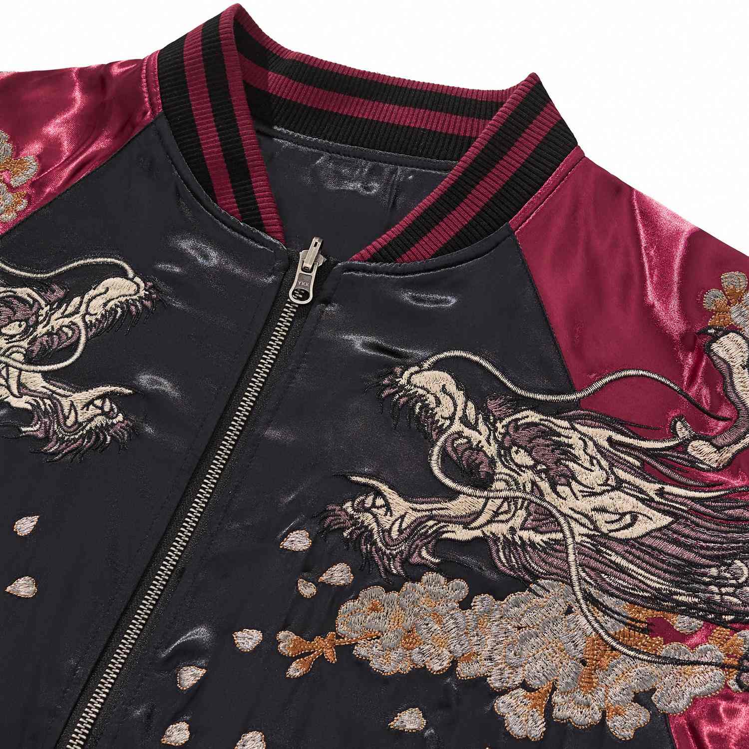 Collar and zipper detail with twin dragon head embroidery.