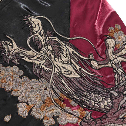 Dragon head embroidery detail with whiskers and teeth.