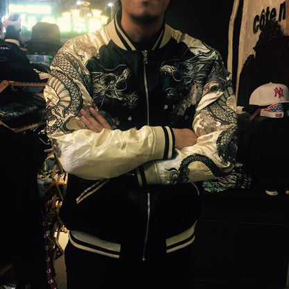 On-body front view — beige sleeves; twin dragons on shoulders and sleeves, sakura accents, indoor lighting.