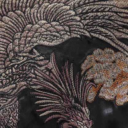 Phoenix feathers embroidery texture close-up.