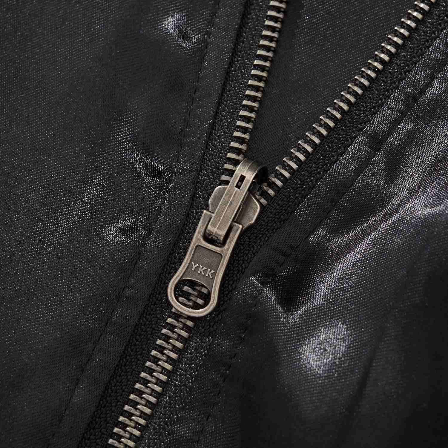 YKK metal zipper pull close-up.