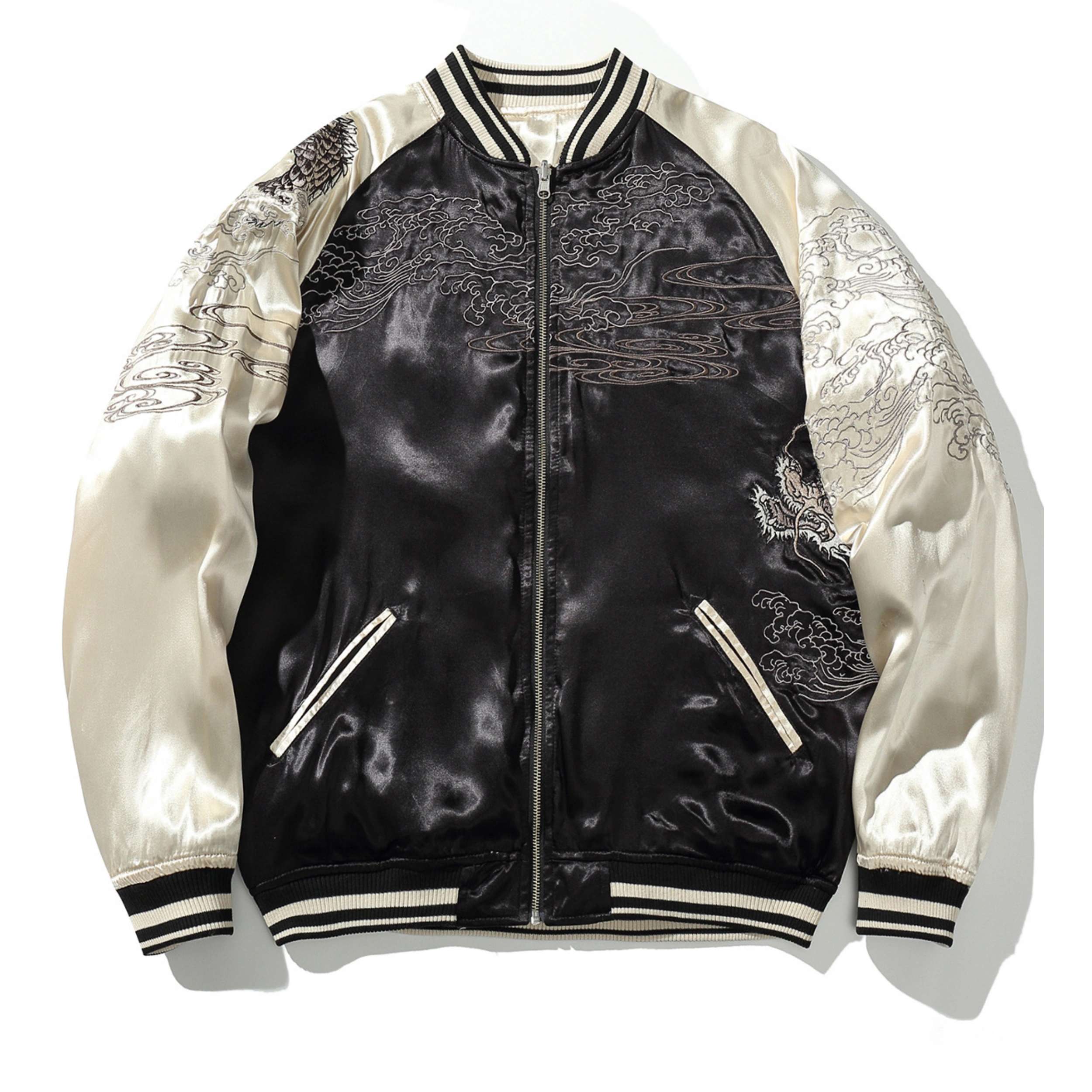 Black side front view — cloud-and-waves embroidery across chest and sleeves.