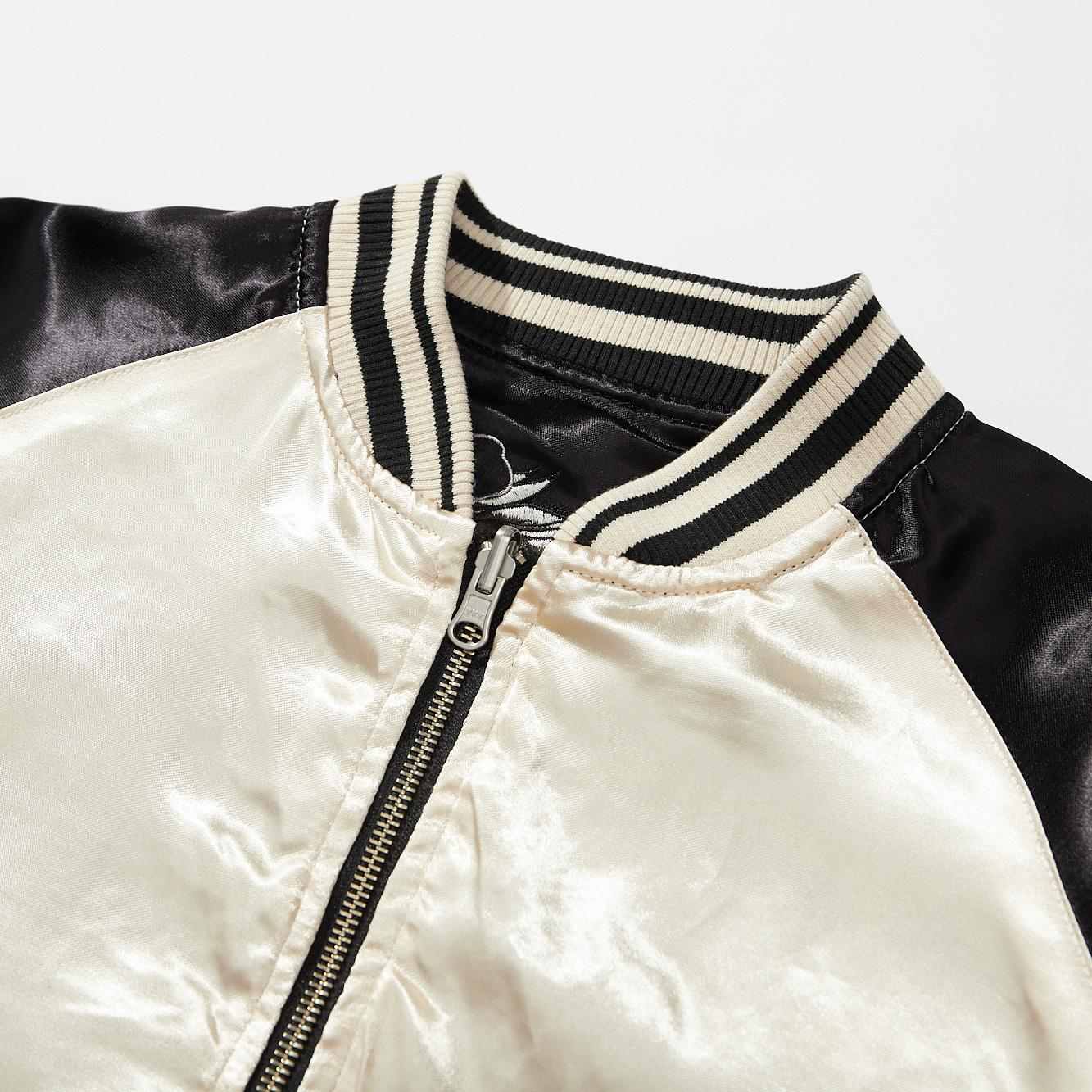 Collar detail — striped rib on the ivory side.