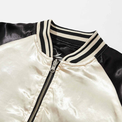 Collar detail — striped rib on the ivory side.