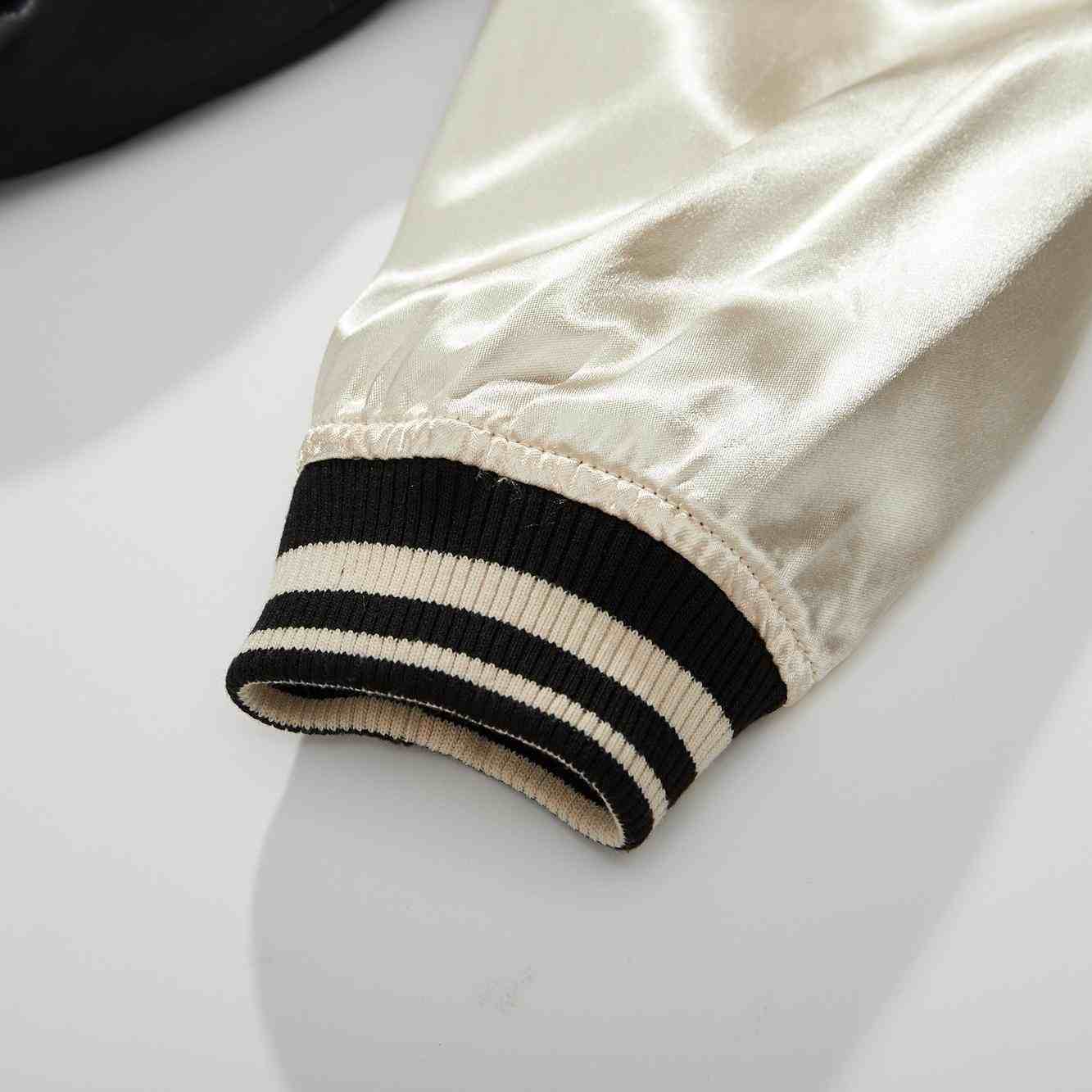 Cuff detail — ivory side striped rib cuff.