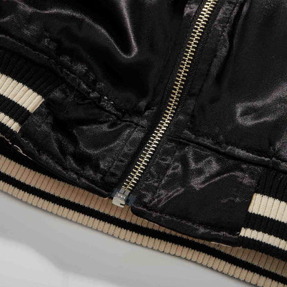 Hem/zip detail — bottom stop with reinforcement stitching.